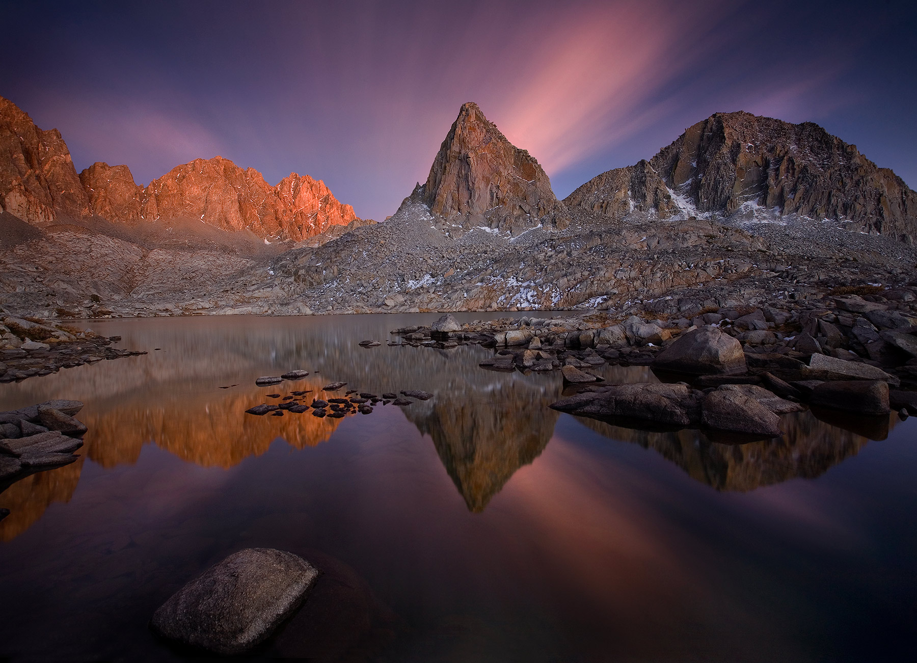 Alpine Luminescence A very long exposure of 10 minutes records twilight colors and clouds streaking across the sky not visible to the eye at the...