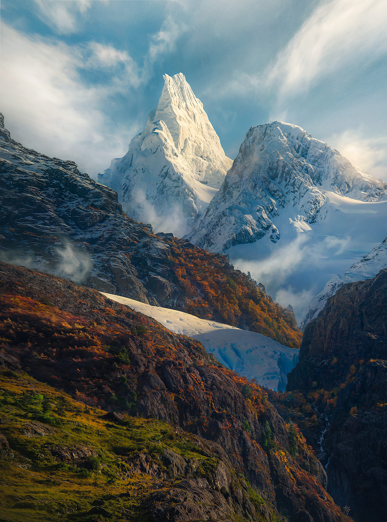 High peaks above the mountainous fiordlands of Chile in Autumn.