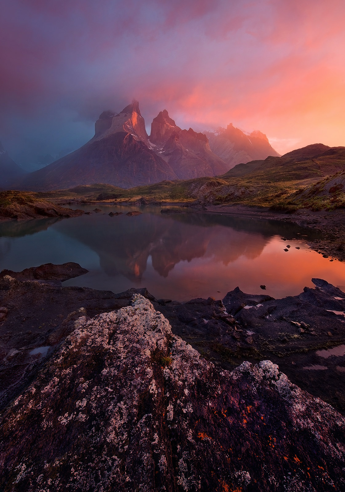 A clearing rainstorm at sunrise, reflections, Torres Del Paine and the light Patagonia is known for.