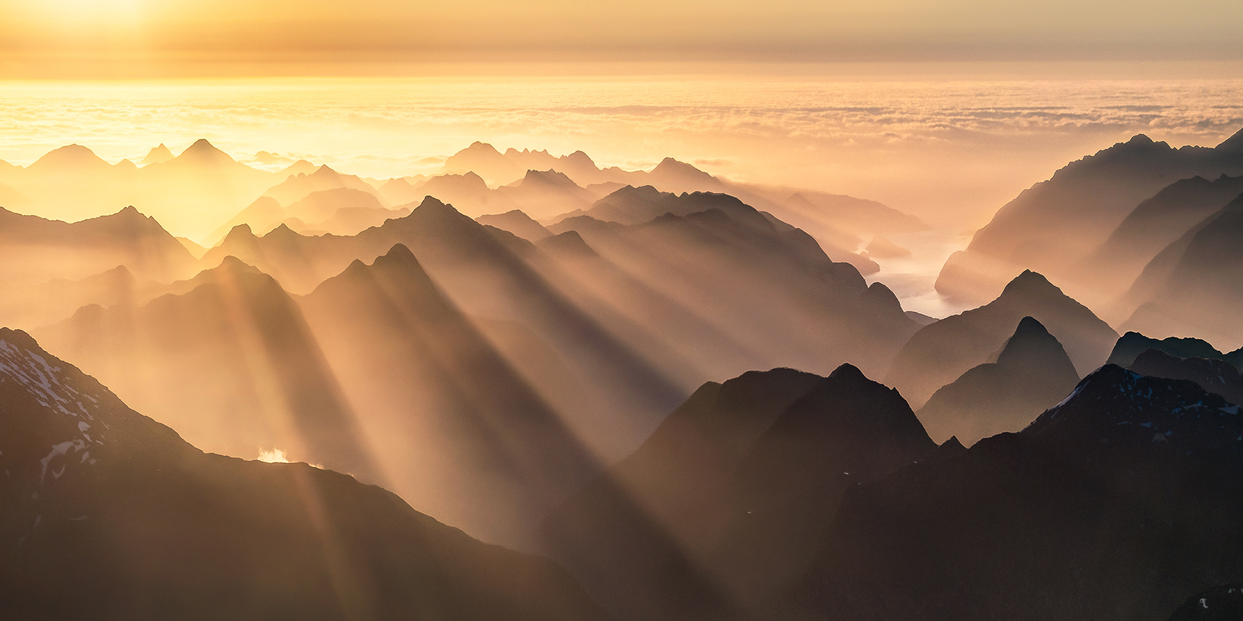 Hazy coastal atmosphere creates an amazing display of light over Breaksea Sound, New Zealand.&nbsp;