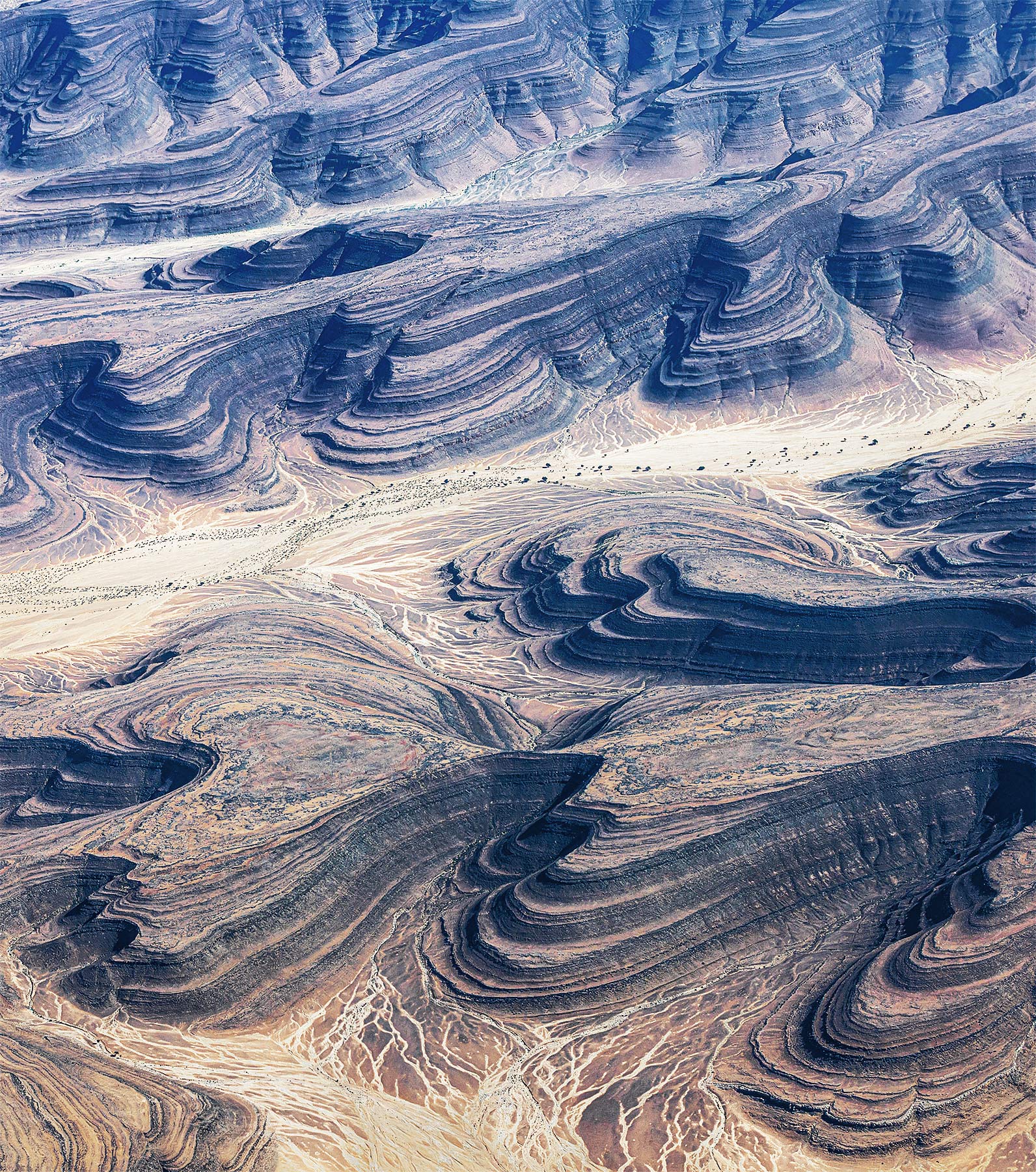 A million canyons and washes through terraced desert above southern Namibia