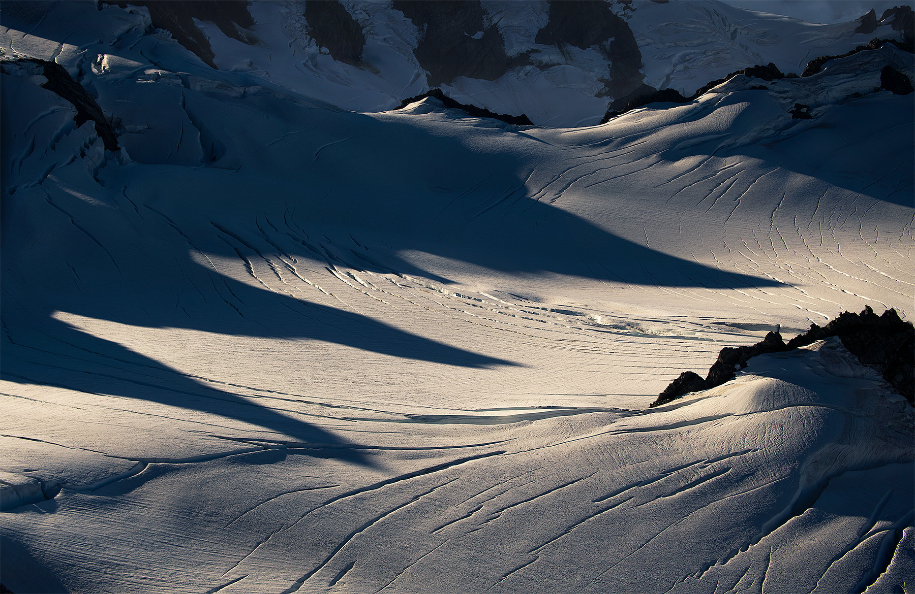 A glacial surface abstract created by the long afternoon shadows and broken textures