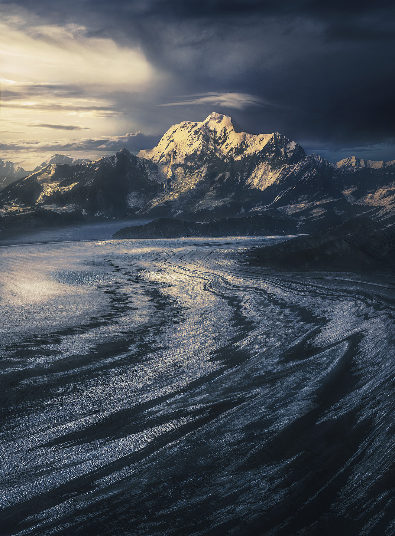 Cold Land The great Mount St Elias catches the light, towering more than fifteen thousand feet higher than glaciers you see below...
