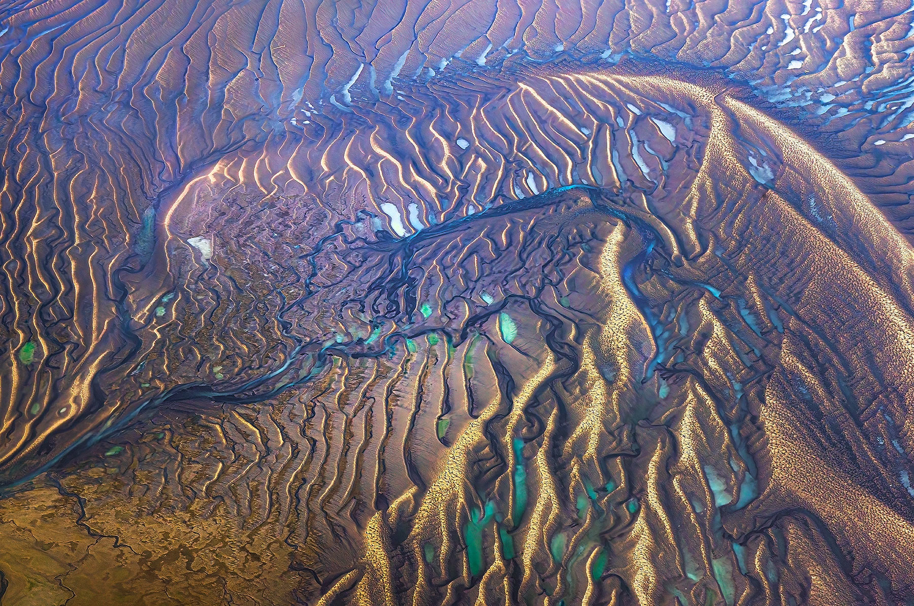 Tidal river planes containing sea water and glacial water mixed in Southeast Alaska, photographed in soft light at low tide.