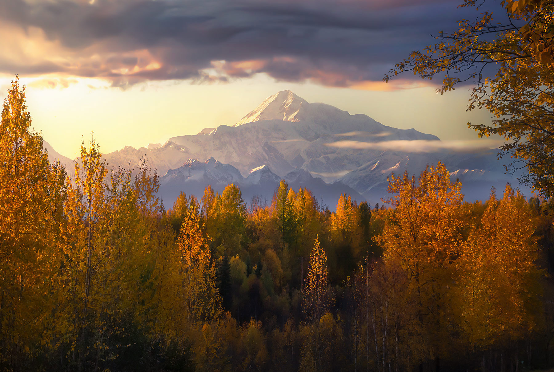 The great peak catches the last light of sunset in Autumn