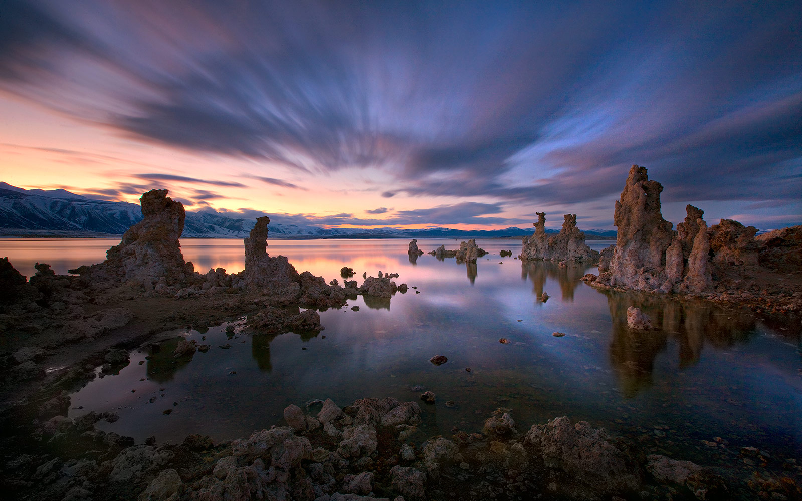 California's Mono Lake photographed at twilight. A long exposure creates the streaks of clouds and smooth water effect you see...