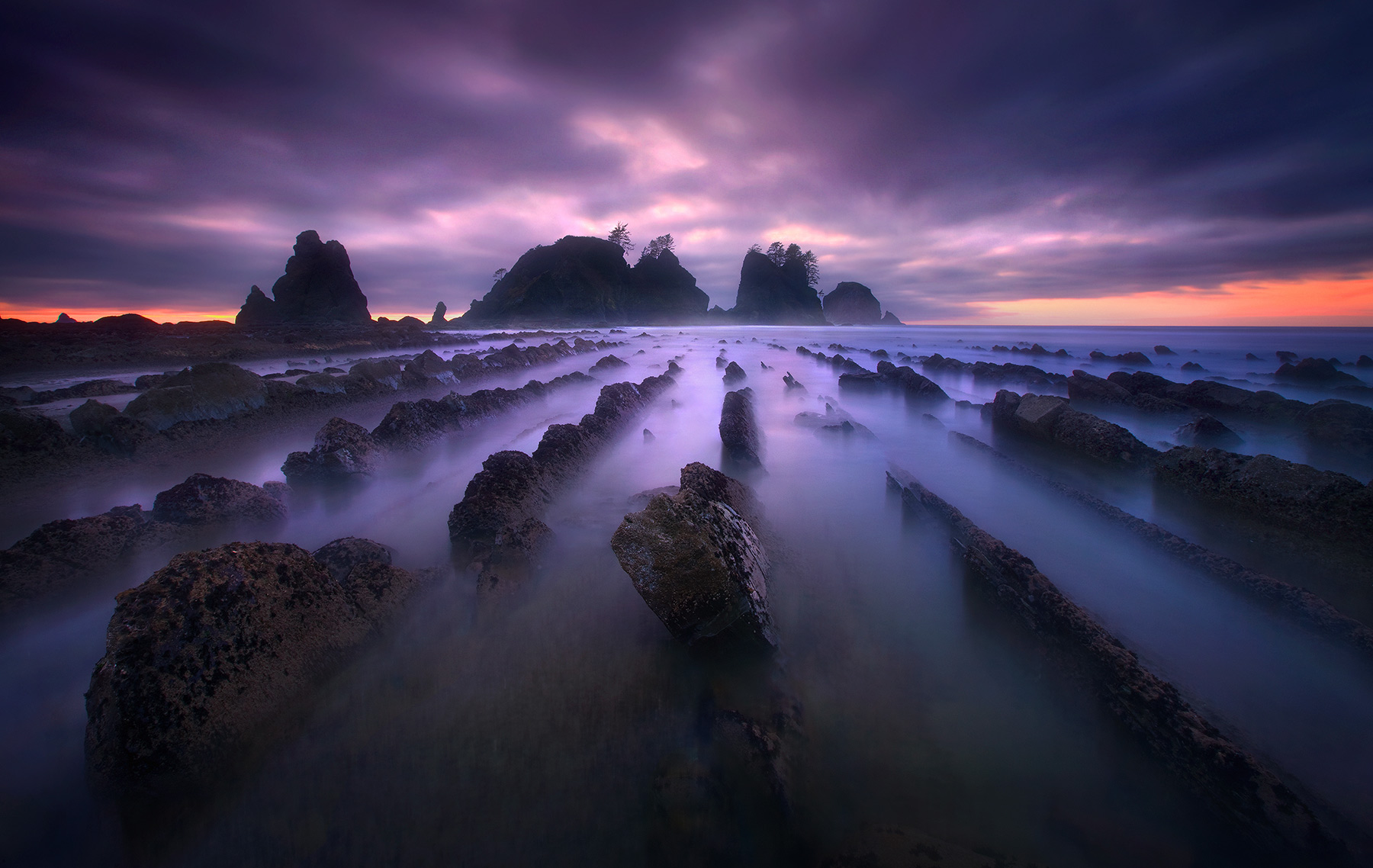 A very long exposure at twilight picks up surreal colors and the beauty of Washington's Olympic wilderness coast.