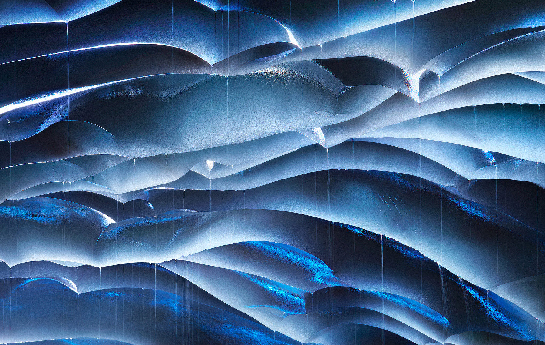 Compression from a 400mm lens creates an amazing abstract from these dripping layers inside an ice cave in Oregon's Three Sisters...