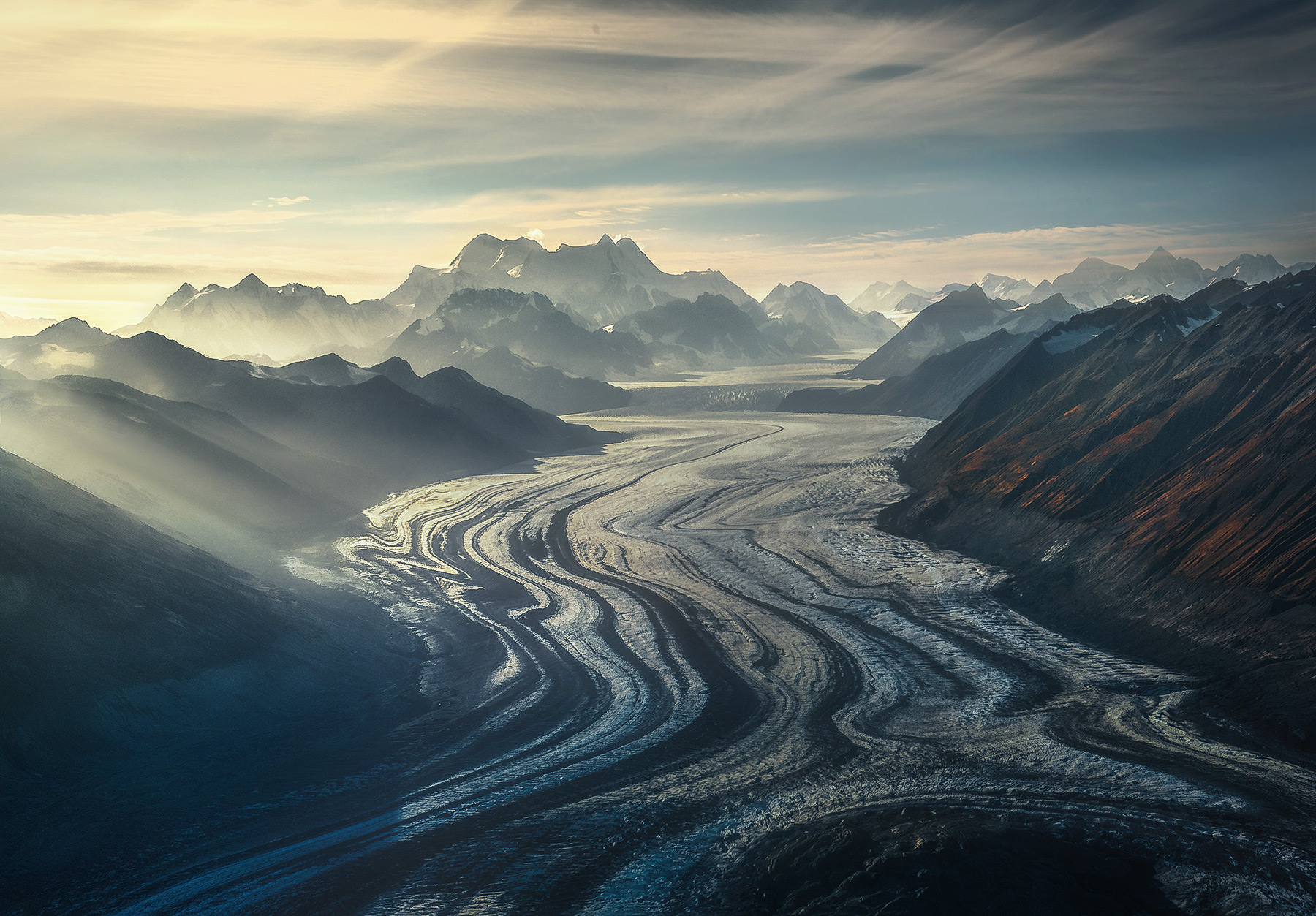Ranges of ever higher mountains the source of these massive flows of ice catching the sun above Wrangell St. Elias, Alaska. &...