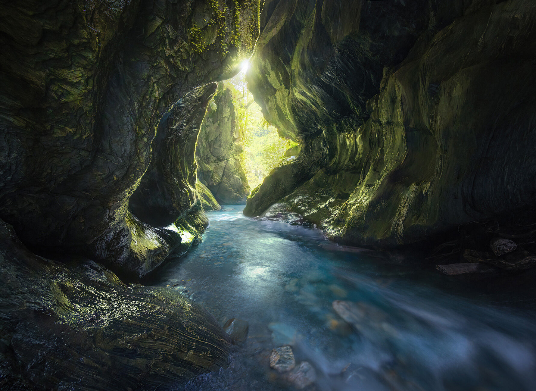 More amazing light in the canyon environment of New Zealand.  Rushing blue waters transport the viewer through walls of shist...