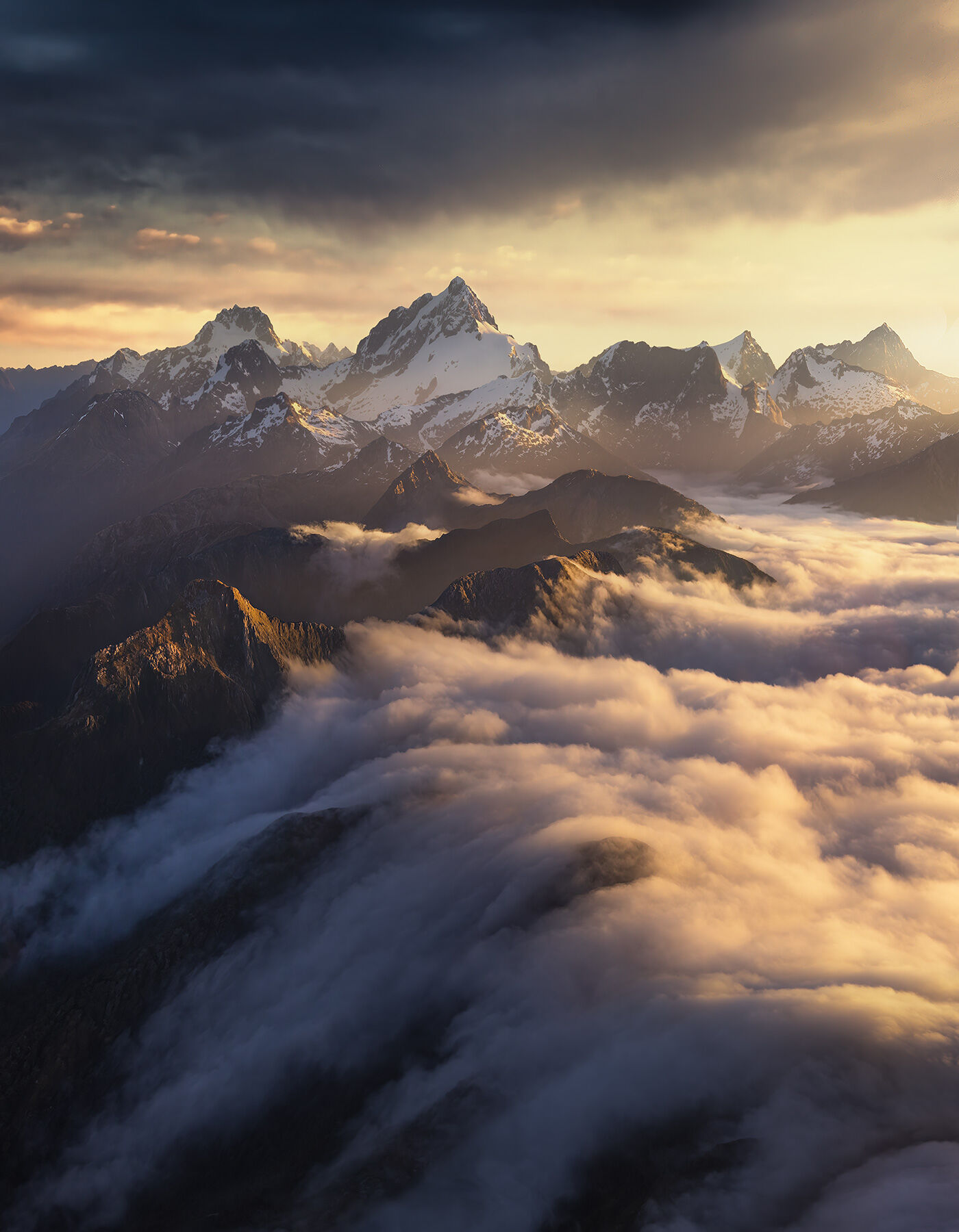 A cloudfall viewed from the air below the biggest peaks in Fiordland, New Zealand