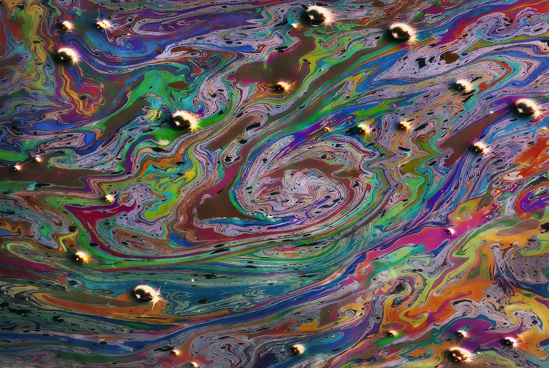 What you are looking at here is a small-scale abstract image of oil floating in the Pacific waters at natural oil seeps off the...