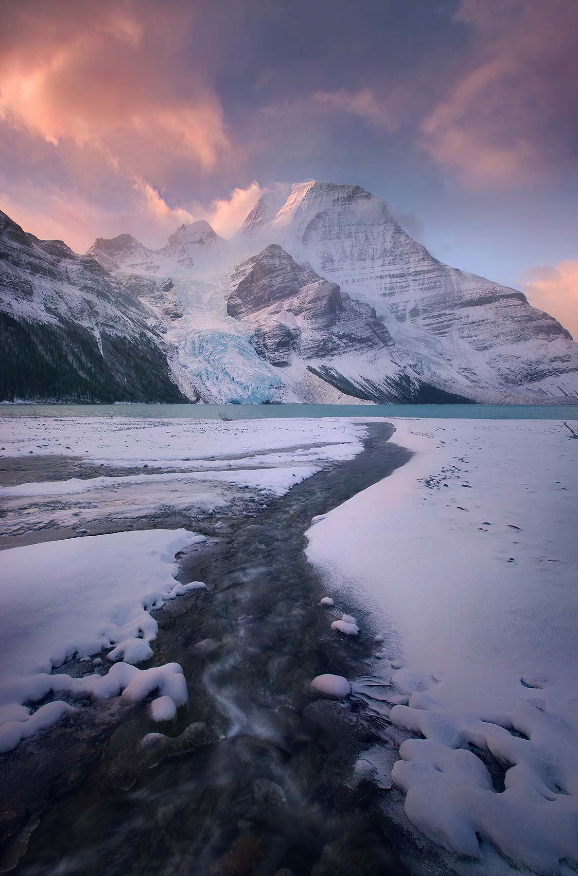 Stunning light and atmosphere over Mount Robson, the Canadian Rockies' highest peak, captured at sunrise.