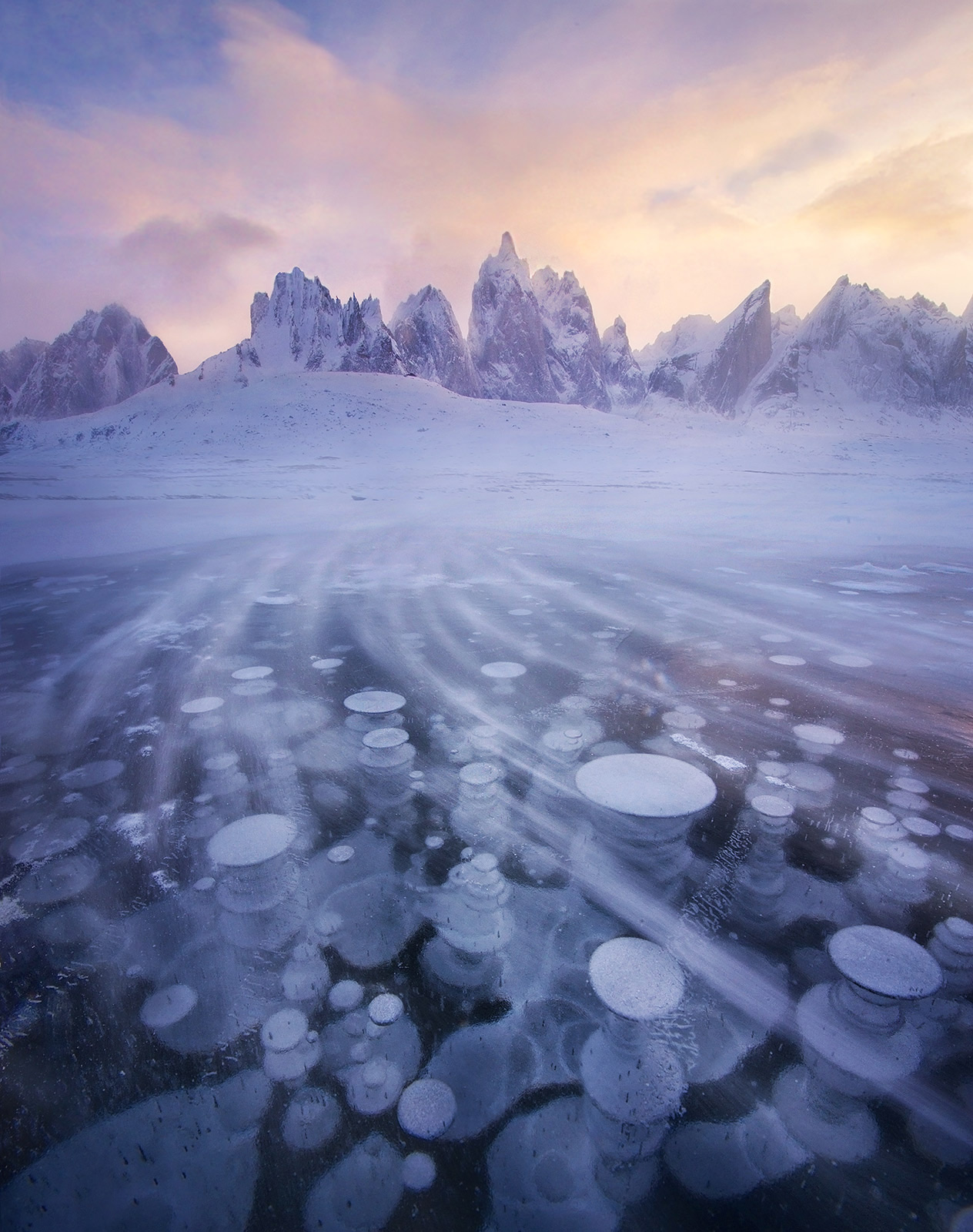 The brutal cold of winter arrives on the wind across this frozen lake in the Yukon's north, captured at the end of a 16-day backpacking...