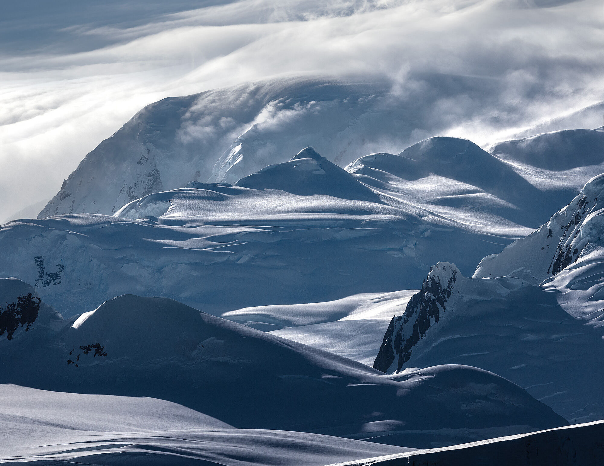 The storm cresting over high peaks