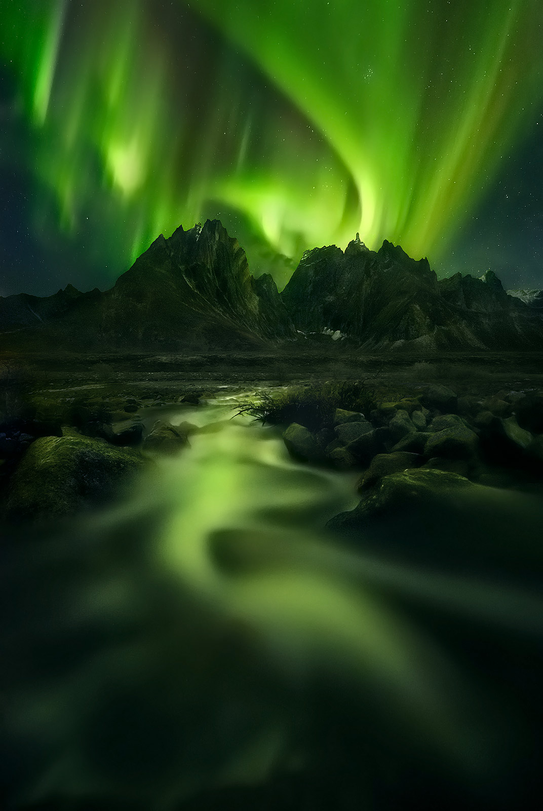 A striking and vibrant display of Auroral lights over high peaks and cascades in Canada's far north.  The best I have managed...