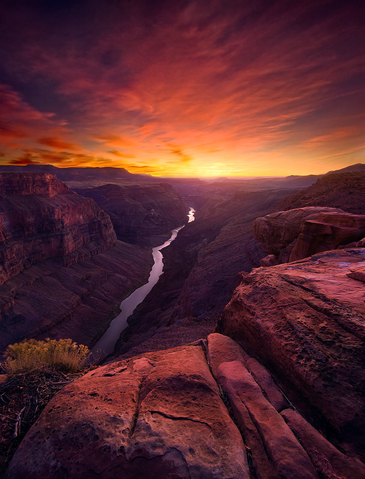 An immensely colorful sunset sky and light reflected over Toroweep at the Grand Canyon, Arizona.