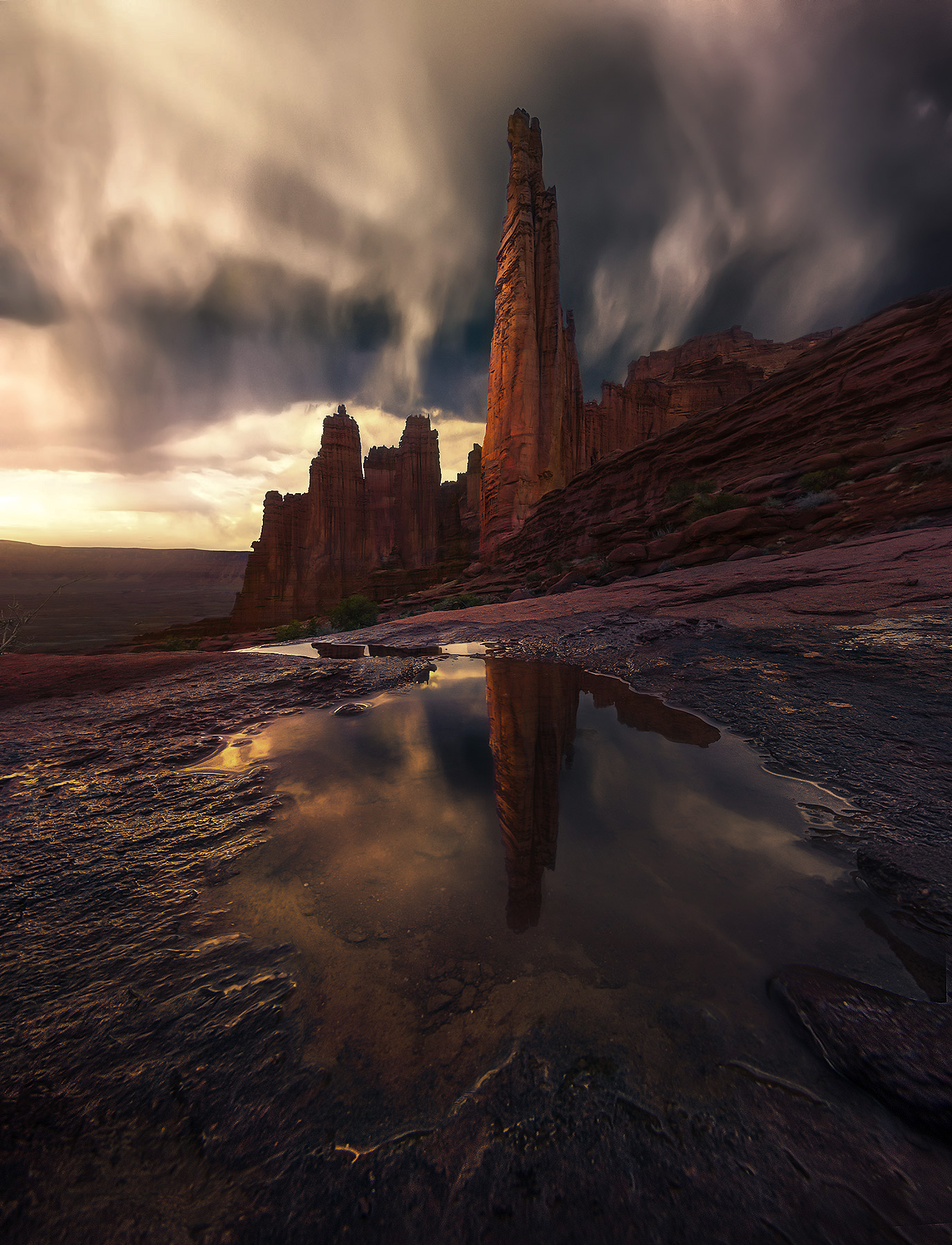 One of the most dramatic cliff faces in Utah catches some storm lighting near sunset after spring rains.