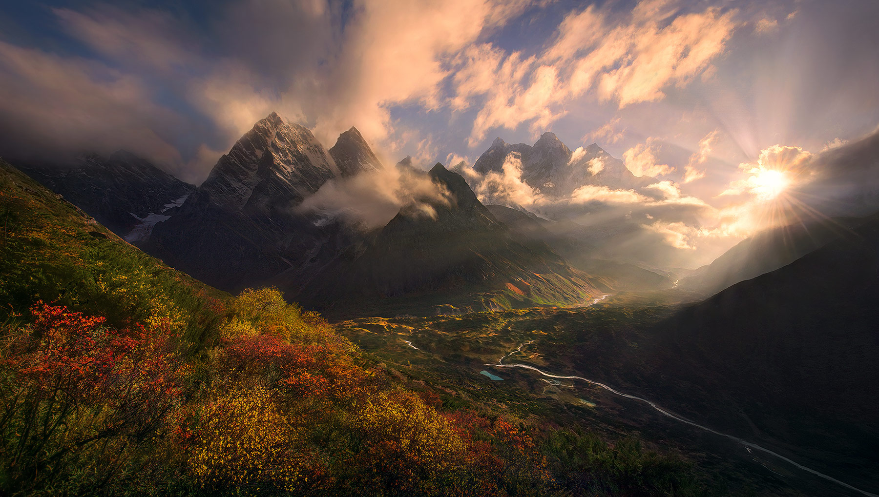 Some incredible evening light bursts through the clouds illuminating Autumn colors beneath Makalu and other high Himalayan peaks...