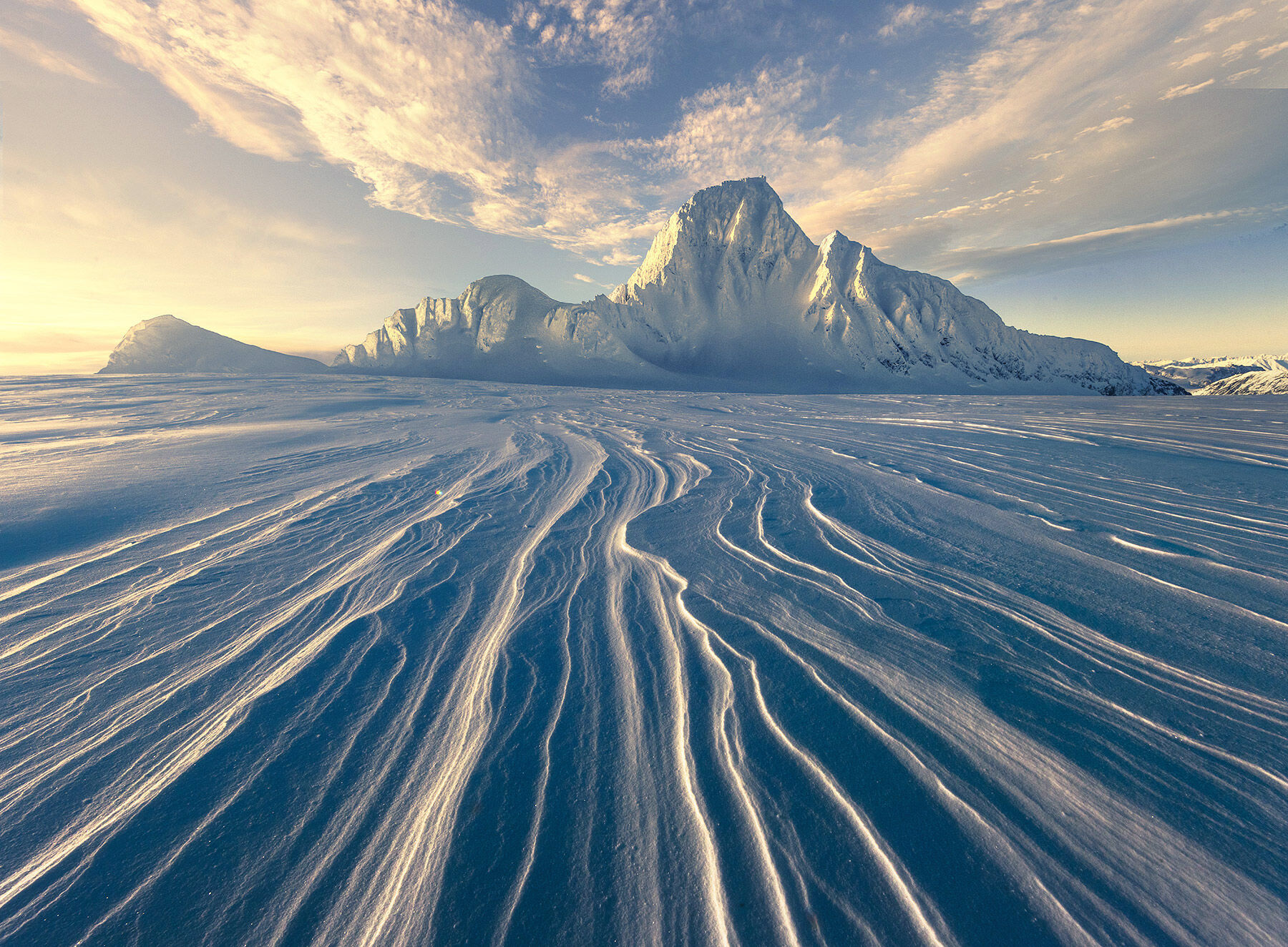 Sastrugi snow left by the wind photographed from the top of a ridiculously remote ice plain in Alaska in winter at 9000ft altitude...