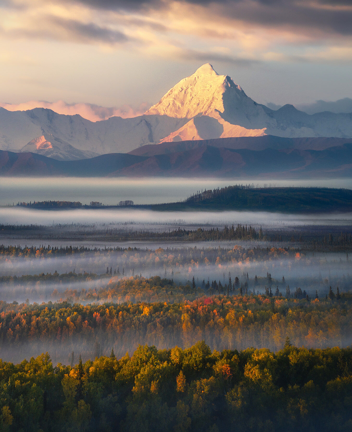 An amazing show of layers filled with autumn colors visible here beneath Alaska's Mount Hayes in Autumn.