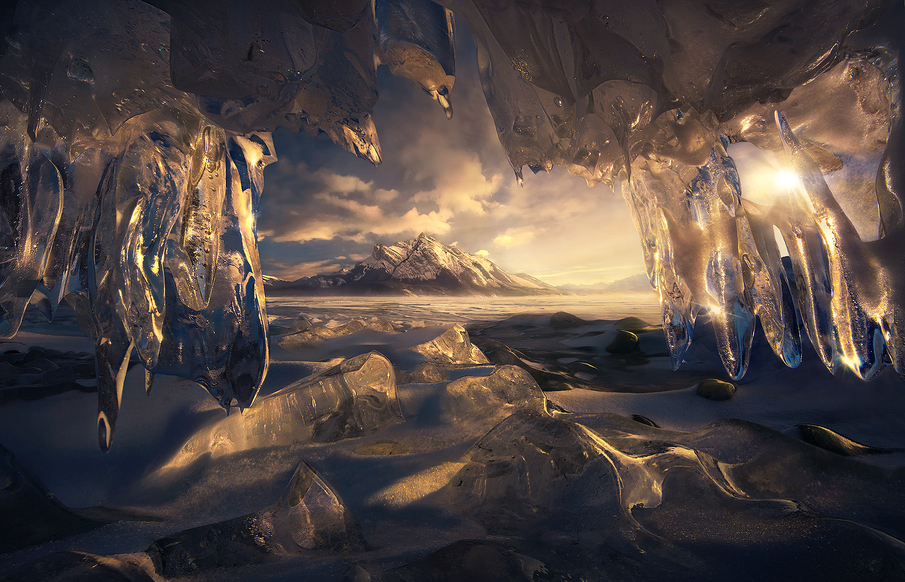 Inside an incredible, sparkling, really really small ice cave looking out.