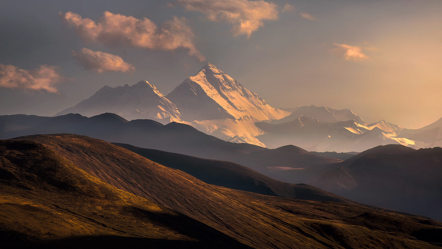 Mount Everest rises above the layers of Tibetan plains.