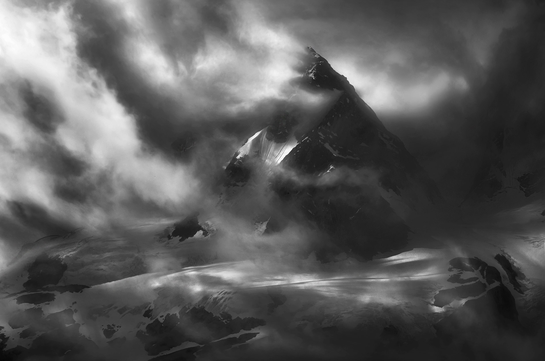 Dramatic clouds pour over high glaciated peaks of these&nbsp;remote&nbsp;coastal mountains.