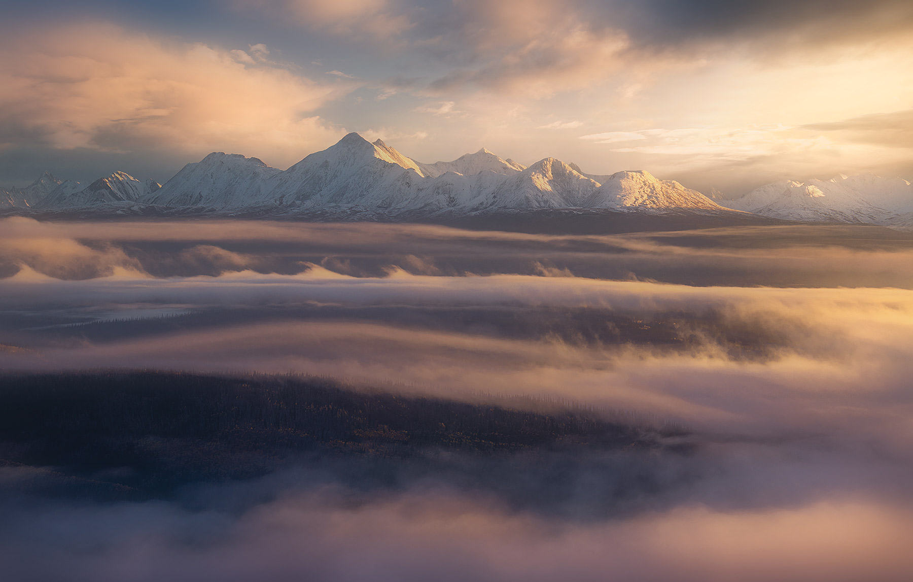 A heavenly view towards Ogilvie Mountains&nbsp;through the early morning mists in the Klondike Valley, Yukon. &nbsp;
