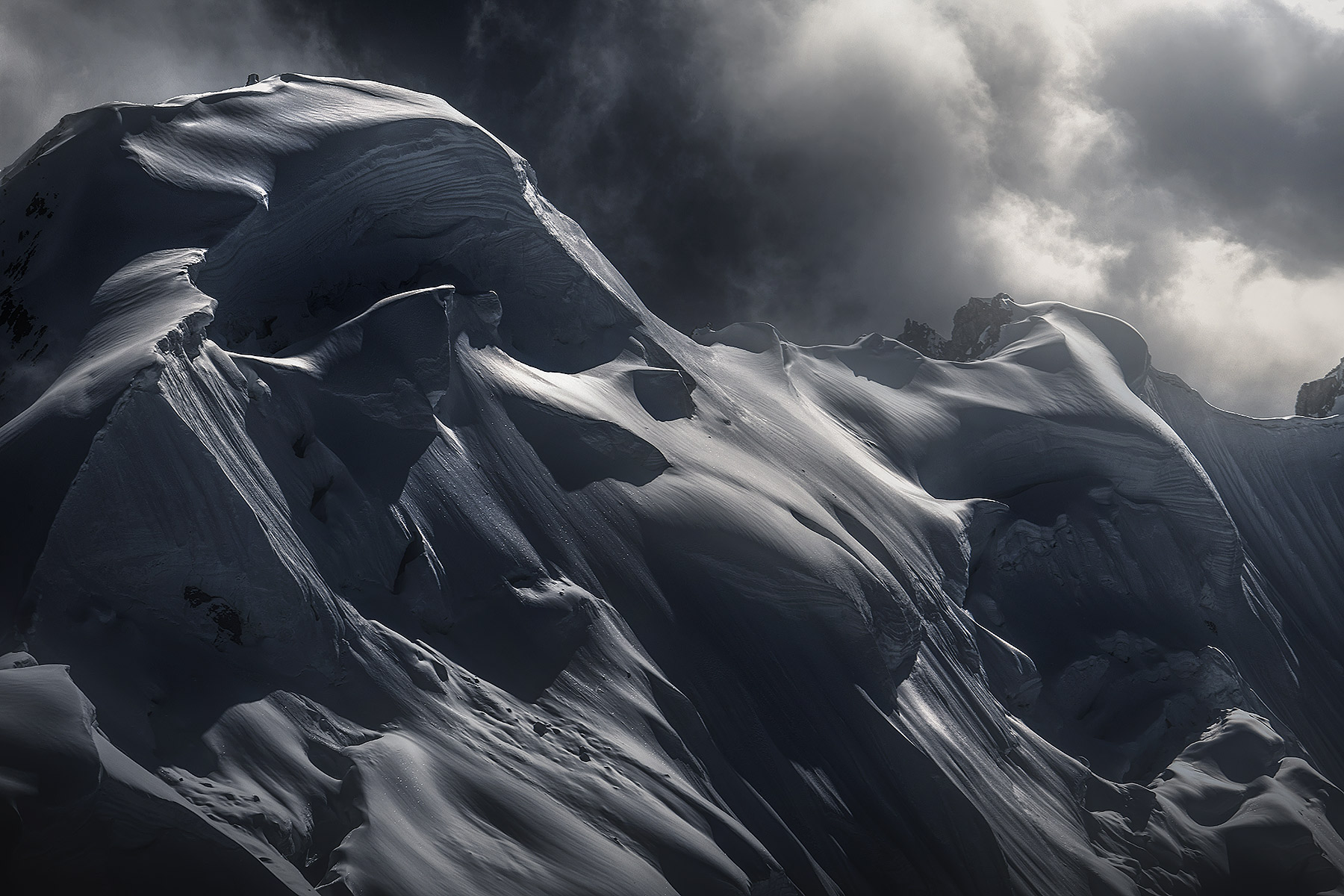 Snow cornices on the shoulders of King Peak, below mount Logan, Yukon at about 13,000ft. &nbsp;An intimate play of light gave...