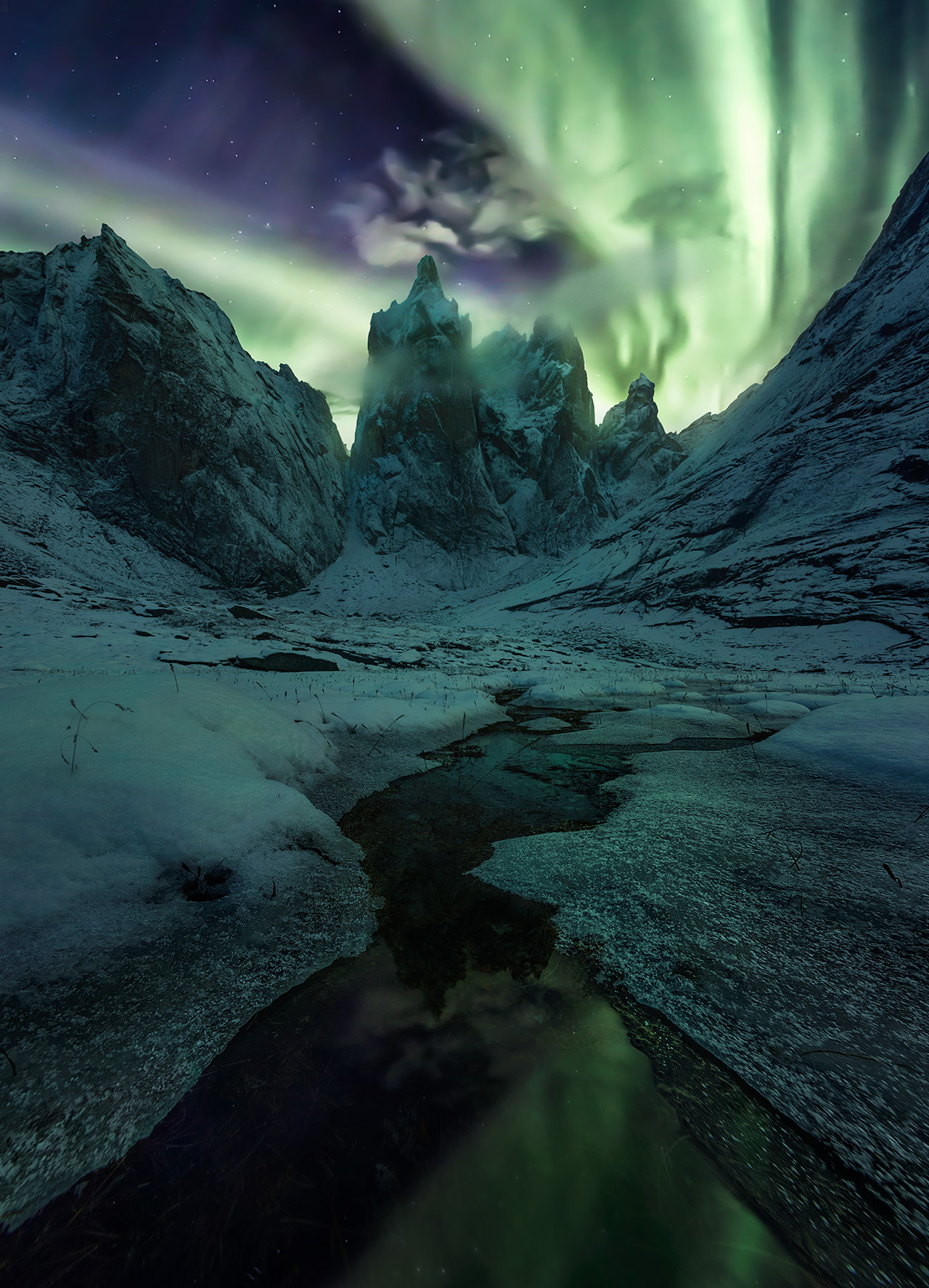 Winter begins and the aurora dances over one of my favorite places anywhere, the base of Mount Monolith, in the Yukon.