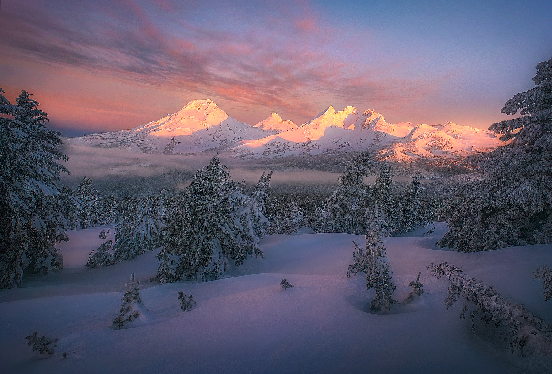 A beautiful winter morning dawns over the snowy Three Sisters wilderness in central Oregon