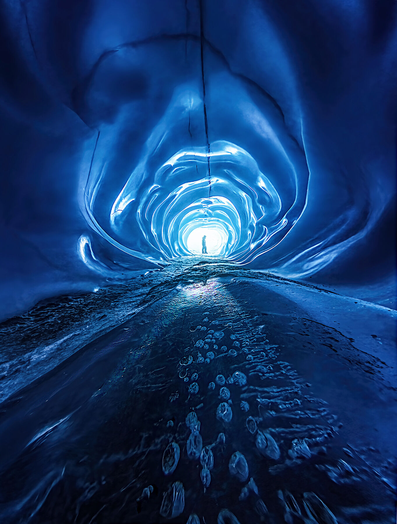 Wormhole A crazy portal-like cave of ice, as if from another dimension. This strange place is actually a glacial moulin, which was turned...